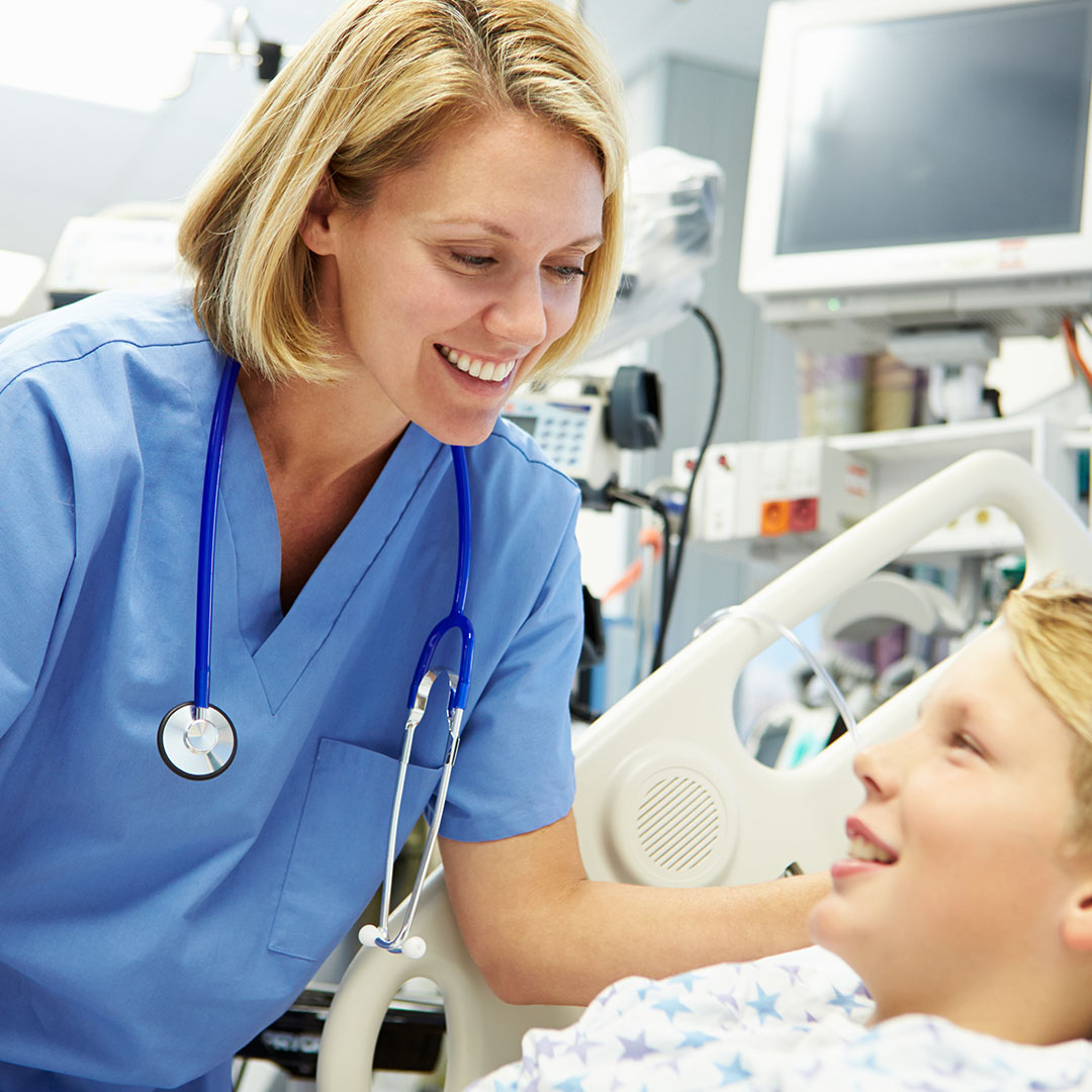 nurse treating young boy