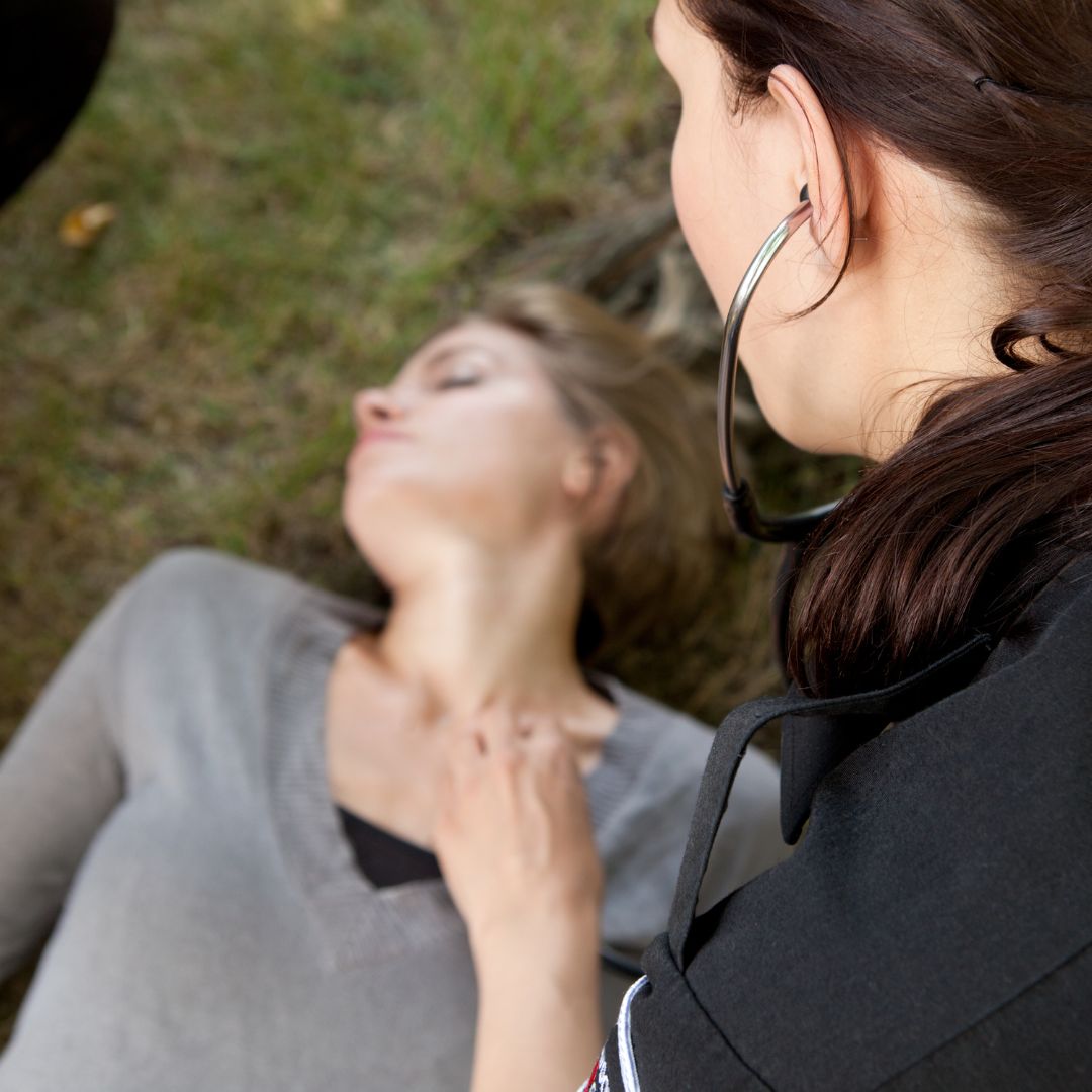 unresponsive woman with first responder